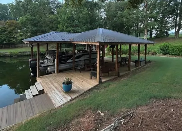 Boat dock with weathered gray decking before cleaning